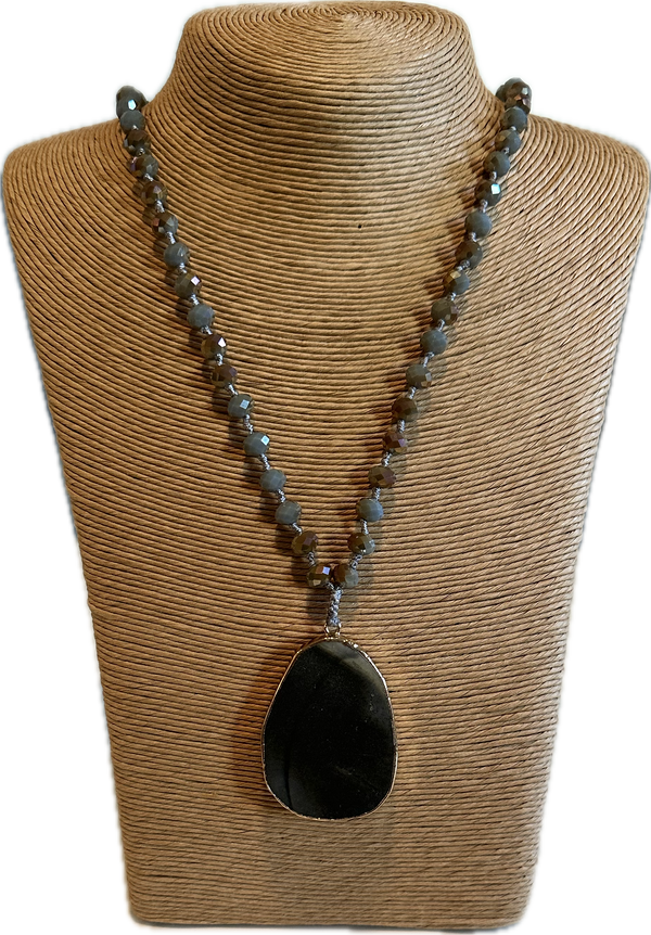 Medallion on long beads