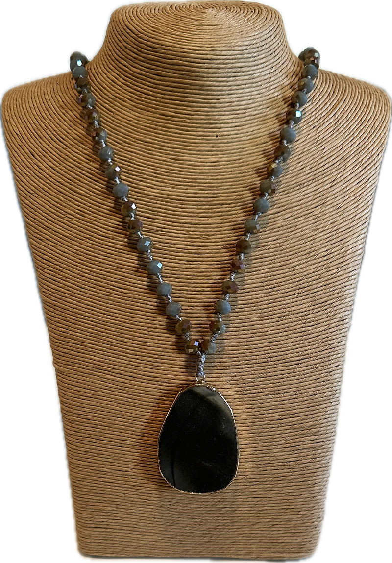 Medallion on long beads