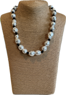 Pearls on black rope