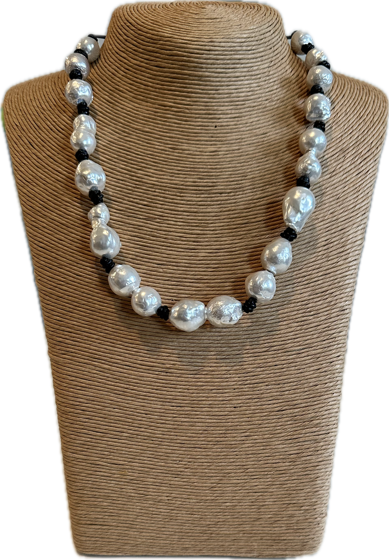 Pearls on black rope