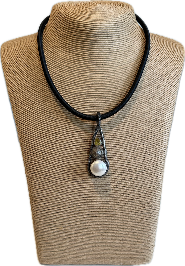 Pearl pendant on black cord